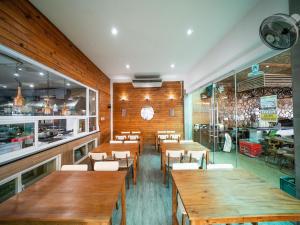 a dining room with wooden tables and chairs at Turtle Beach Resort in San Juan +62 photos