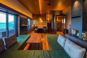 a living room with a couch and a table at Sunset SPA Resort AJI by SETO CLAS in Takamatsu +47 photos