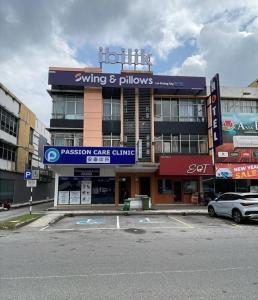a parking lot in front of a building at Swing & Pillows - Bukit Tinggi, Klang in Klang