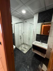 a bathroom with a shower and a sink at Mitra Black Sea in Arhavi