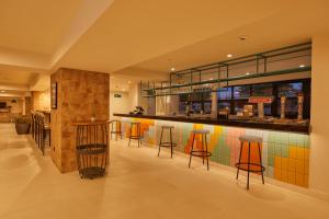 a bar in a restaurant with colorful tiles at Alua Calvia in Magaluf