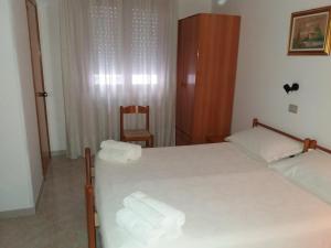 Postel nebo postele na pokoji v ubytování Hotel Europa