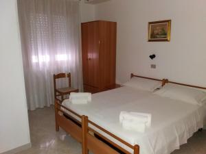 Postel nebo postele na pokoji v ubytování Hotel Europa