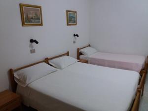 Postel nebo postele na pokoji v ubytování Hotel Europa