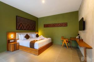 a bedroom with a bed and a desk in it at ME Villa Pererenan in Canggu +15 photos