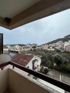 a balcony with a view of a city at Apartment Dream in Boreti
