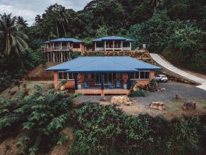 an aerial view of a house in the forest at Potter House VILLA PITA vue sur lagon et village de Fare in Teapaa