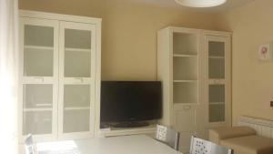 Televízia a/alebo spoločenská miestnosť v ubytovaní Tres Cruces Apartment