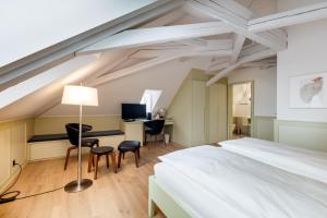 Rúm í herbergi á Hotel Krone Speicher