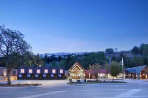 a large building with a street in front of it at Swiss-Belresort Coronet Peak in Queenstown