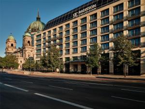 a building on the side of a street next to a road at Radisson Collection Hotel, Berlin in Berlin