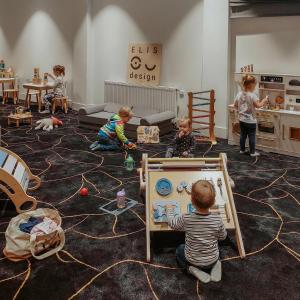 a group of children playing in a living room at OREA Congress Hotel Brno in Brno