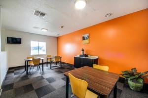 a room with a table, chairs, and tables in it at Motel 6 New Braunfels in New Braunfels