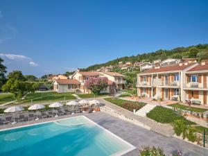 an aerial view of a house with a swimming pool at Residence Green Park in Torri del Benaco