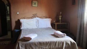 Postel nebo postele na pokoji v ubytování Riad Dar Barbara