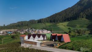 an aerial view of a village on a hill at Dieng Ceria Resort in Diyeng