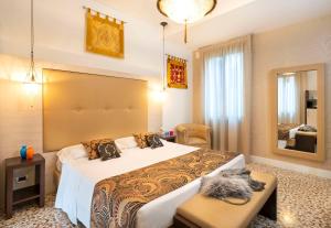 a bedroom with a large bed in a room at Maison Spada in Venice