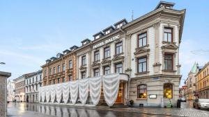 a large building with a sign on the side of it at Best Western Plus Hotel Baltic in Sundsvall