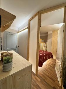 a room with a sliding glass door leading to a bedroom at Lilli apartment in Aprica