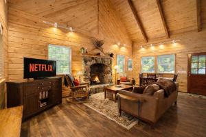 a living room with a couch and a fireplace at Chipmunk Lodge by NW Comfy Cabins in Leavenworth