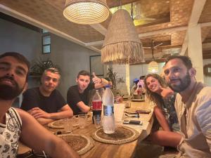 a group of people sitting around a table at Crown pyramids hotel in Cairo