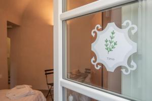 a window with a time sticker on the glass at Locanda Mirei in Finale Ligure +141 photos