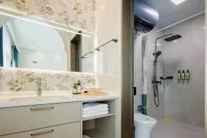 a bathroom with a sink and a shower at LeD Courtyard Homest ay乐东小院民宿 in Beijing +24 photos