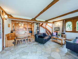 a living room with a couch and a table at Chalet Marinette in Icogne