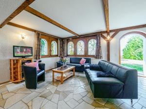 a living room with two couches and a tv at Chalet Marinette in Icogne +37 photos