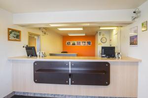 an office with a reception counter in a waiting room at Motel 6-Rochester, MN in Rochester
