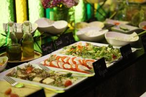 a buffet with plates of food on a table at Liebeskind Boutique Hotel Old Town in Krakow