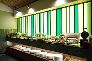 a buffet line with plates of food on a table at Liebeskind Boutique Hotel Old Town in Krakow
