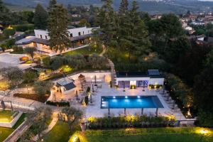 an aerial view of a mansion with a swimming pool at Villa Bocchi by Geco Vacation Rentals in Negrar