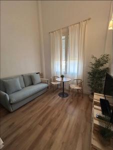 a living room with a couch and a table at Las Marismas-Puente del Rey in El Rocío