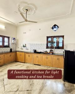a functional kitchen for light cooking and tea breaks at Ashiana By Ijabojyu- Pet friendly Homestay in Dehradun