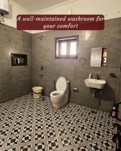 a bathroom with a toilet and a sink at Ashiana By Ijabojyu- Pet friendly Homestay in Dehradun