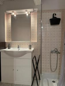 a bathroom with a sink and a shower at Chez Julie in Valleraugue +31 photos