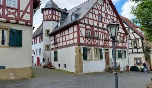 a building with a street light in front of it at Sudhaus/Alte Brauerei in Meisenheim