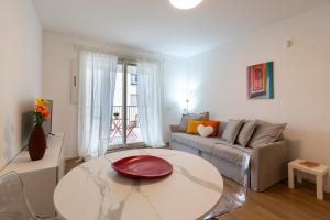 a living room with a couch and a table at Nolo Town Luxury Place in Milan +24 photos