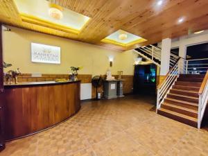 a lobby with a bar and a staircase in a building at Grand Ranketha Resort in Kalutara +21 photos