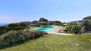 an aerial view of a house with a swimming pool at Fattoria delle Ripalte in Capoliveri