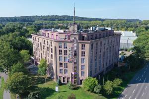 an overhead view of a building with a tower on top at Augenblick Goodnight in Kleve