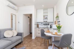 a kitchen and living room with a couch and a table at RoomService in Bielsko-Biała +59 photos