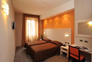 Voodi või voodid majutusasutuse Hotel Cavour toas