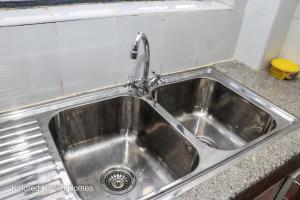a stainless steel kitchen sink with a faucet at Machakos Town 3 Bedroom Ensuite in Machakos