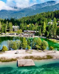 an island in the middle of a body of water at JASNA NATUR Resort by the lake in Kranjska Gora