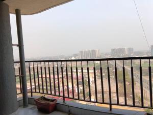 a balcony with a view of a city at Hotel Presidency in Surat