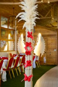 a pole with red and white decorations in a room at Maison du Bonheur in Dakar