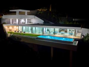 a large house at night with its lights on at Villa Gia in Calheta