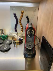 a toaster sitting on top of a counter in a kitchen at Cortirola luxury apartment in Pesaro +12 photos